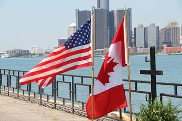 U.S. and Canadian flags along Windsor's riverfront.  (Photo by Melanie Borrelli.)