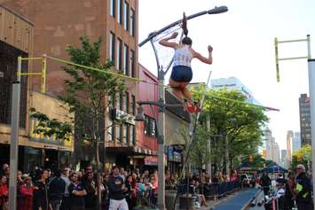 Athletes compete in a pole vaulting competition on Ouellette Ave., May 22, 2015. (Photo by Jason Viau)