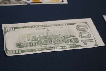 Counterfeit money found by the Windsor Police Service on display at media conference, December 1, 2015 (Photo by Maureen Revait) 