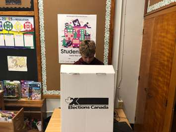 King George VI Grade 4/5 student Paxton Paradis marks his ballot in a mock municipal election. October 21, 2022 Image courtesy of Susan Shaw.
