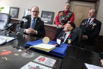 Local World War II veteran Ralph Mayville speaks with reporters on February 6, 2015 about receiving the Congressional Gold Medal. (Photo by Jason Viau)