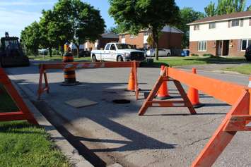 Chatham-Kent municipal crews work to repair a section of Wedgewood Dr. in Chatham. May 30, 2016. (Photo by Matt Weverink)