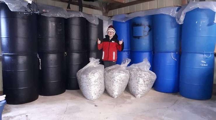 Jace Weber shows off his world record breaking collection of can tabs. Photo by Candice Weber. 