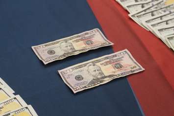 Counterfeit money found by the Windsor Police Service on display at media conference, December 1, 2015 (Photo by Maureen Revait) 
