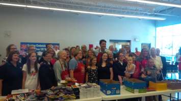 Prime Minister Justin Trudeau poses with school children and staff at the Goderich Salvation Army after helping fill back packs for kids to start the school year. August 25th, 2017 (Photo by Bob Montgomery)