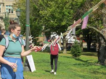 A Western student reads cards of support left for survivors of sexual violence , September 17, 2021. (Photo by Miranda Chant, Blackburn News)
