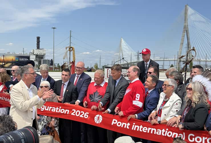 Dignitaries, including Premier Doug Ford, Essex County Warden Hilda MacDonald, and Murray Howe, son of Gordie Howe, prepare to cut the ribbon to dedicate the Gordie Howe International Bridge on July 24, 2026. Photo by Maureen Revait.