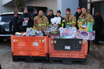 Windsor firefighters collect toys from Chrysler, being donated to Sparky's Toy Drive, November 20, 2014. (photo by Mike Vlasveld)