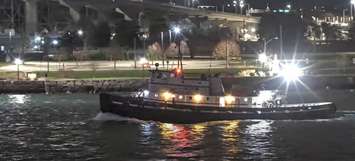 A tug boat called in to help the Wilfred Sykes bulk freighter after the large vessel lost its steering near the Blue Water Bridge. 25 November 2021. (Photo by Blue Water Convention Centre in Port Huron)