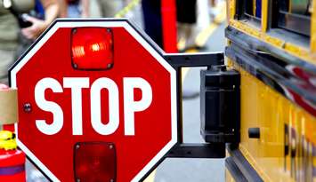 Stopped school bus. (Photo by © Can Stock Photo / Vonora). 