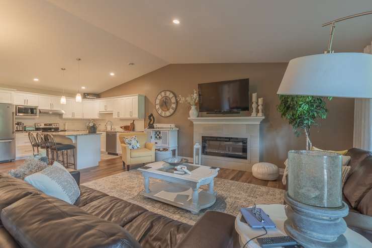 The living room and kitchen of a Gold Leaf Properties townhome. Image courtesy of Gold Leaf Properties. 