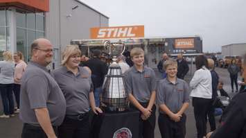 Southpoint Equipment President and Sales Manager David Ross and his family poise with the Grey Cup. October 4, 2019. (BlackburnNews photo by Colin Gowdy)