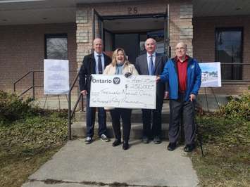 The Ontario Government commits $250,000 from the Rural Economic Developoment Fund to the Teeswater Medical Centre.
From left to right: Dwight Leslie (Medical Centre Fundraising Chair), Huron-Bruce MPP Lisa Thompson, Larry Hayes (Co-Chair of Medical Centre Steering Committee), Robert Buckle (Mayor of South Bruce). (Image taken by Steve Sabourin)