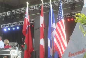 The flags of Ontario, Canada, Windsor, and the United States displayed at the 2022 CanAm Police Fire Games opening ceremonies at Riverfront Festival Plaza, Windsor, July 26, 2022. WindsorNewsToday.ca file photo.