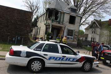 Windsor police continue to investigate at 579 Church St. after an arson, May 6, 2015. (Photo by Mike Vlasveld)