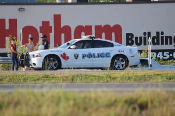 Police investigate a motorcycle crash on EC Row at Howard Ave., August 18, 2015. (Photo by Jason Viau)
