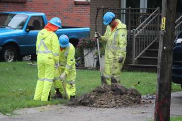 Utility crews dig for a gas line after lightning starts a fire in the 1100-block of Belleperche Pl., September 3, 2015. (Photo by Jason Viau)