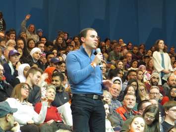 A man asks Prime Minister Trudeau a question regarding human rights at a town hall meeting at Western University, January 13, 2017. (Photo by Miranda Chant, Blackburn News)