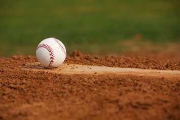 Ball on a pitchers mound. © Can Stock Photo / 33ft