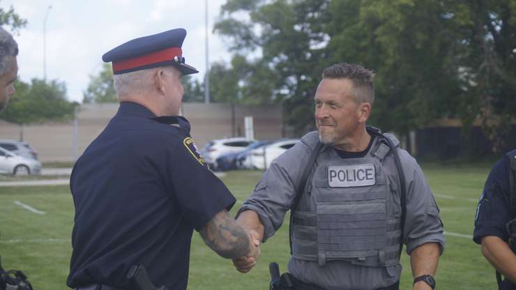 Cst. Shawn Urban receiving his certificate for the completion of the Police Service Dog course, August 9, 2024 (Photo by: Lindsay Newman/ Blackburn Media)