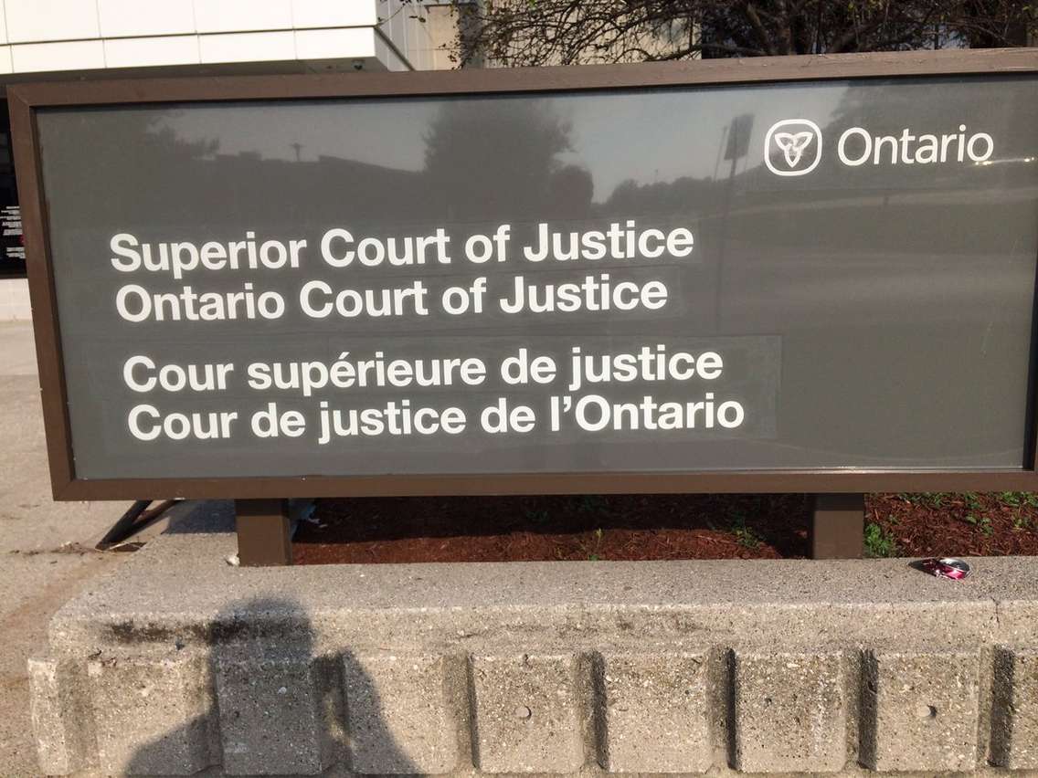 Sign outside of the court in Chatham, ON. Sept 25, 2017. (Photo by Paul Pedro)