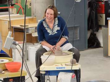 Ceramics Professor Beth Turnbull-Morrish teaches the proper technique during the Celebrity Bowl-a-Thon - Feb 13/23 (Blackburn Media Photo by Josh Boyce)