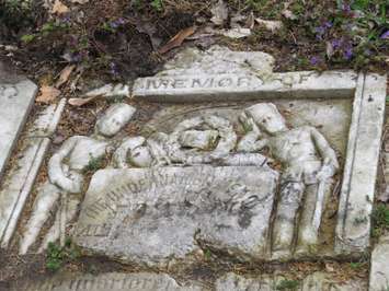 A Confederation-era tombstone uncovered by Western students at Woodland Cemetery. (Photo by Miranda Chant, Blackburn News)