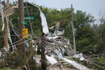 Crews assess and clean up the damage left near the EC Row Expressway and Central Avenue in Windsor on August 25, 2016 after a tornado hit the area. (Photo by Ricardo Veneza)