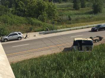 Mini camper trailer flips on Hwy. 402 Aug. 10, 2017 (Photo by Melanie Irwin)
