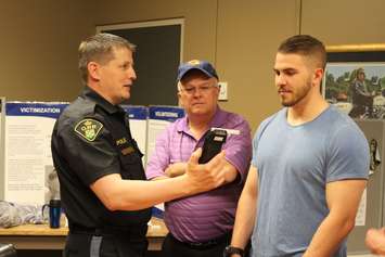 Members of the public are taken on a tour of the Chatham-Kent OPP detachment on May 19, 2016. (Photo by Ricardo Veneza)