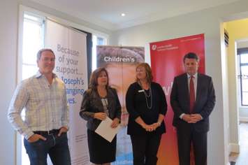 Douglas Wastell of Wastell Homes, President and CEO of St. Joseph's Health Care Foundation Michelle Campbell, Chief Development Officer of Children's Health Foundation Sherri Bocchini, and President and CEO of London Health Sciences Foundation John MacFarlane speaking at the Dream Lottery Home at 2337 Humberside Common in London, October 5, 2016. (Photo by Miranda Chant, Blackburn News)