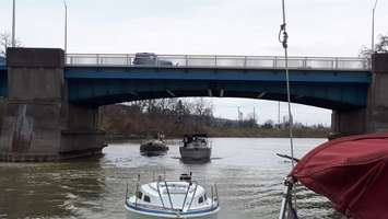 Members of the Thames River Yacht Club passing under a bridge (Image courtesy of the Thames River Yacht Club)