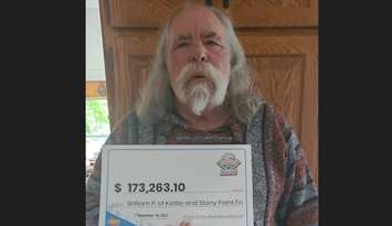 William Powell of Kettle and Stony Point First Nation with his OLG winnings of $173,263.10. September 2023. (Photo by OLG)