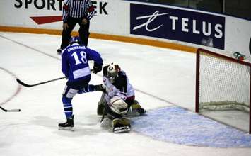 Canada White goaltender Samuel Harvey makes a sparkling glove save in 5-1 loss to Finland Nov. 2, 2014 at the RBC Centre. (BlackburnNews.com photo by Dave Dentinger)