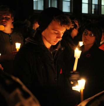 Teammates, friends and family of Michael Matte gather outside of General Amherst High School for a candlelight vigil, November 10, 2014. (photo by Mike Vlasveld)