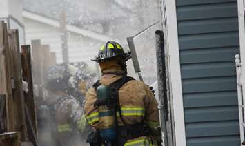 Windsor fire battling a blaze on Hickory St. in Ford City, March 23, 2016 (Photo by Maureen Revait)