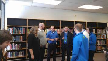 Librarian Jessica Weening and Principal Jim Stewart speak with Best Buy representatives.  February 8, 2018. (Photo by Colin Gowdy, Blackburn News)