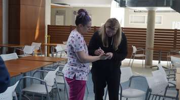 Dr. Hayley Wickenheiser signs an autograph. May 18, 2023. (Photo by Natalia Vega)