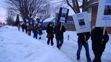 Protesters picket outside an apartment on Taylor Ave in Chatham (Photo taken by Jake Kislinsky).