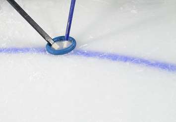 Ringette sticks fight for the ring. © Can Stock Photo Inc. / Pixart