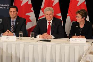 Essex MP Jeff Watson, left, Prime Minister Stephen Harper and Minister of Public Works and Governmental Services Diane Finley talk about auto manufacturing in Windsor, May 13, 2015. (Photo by Jason Viau)