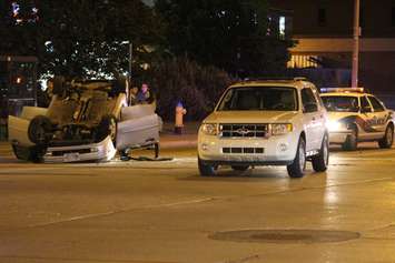 One vehicle flipped following a collision at the intersection of Howard Ave. and Tecumseh Rd. E, May 19, 2015. (Photo by Jason Viau)