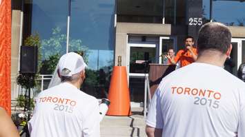 Pan Am representative kicking off celebrations outside City Hall, June 16, 2015 (BlackburnNews.com Photo by Briana Carnegie)