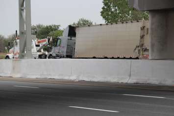 Two transport trucks collide in the eastbound lanes of Hwy. 401 just west of the Dougall overpass, June 18, 2015. (Photo by Jason Viau)