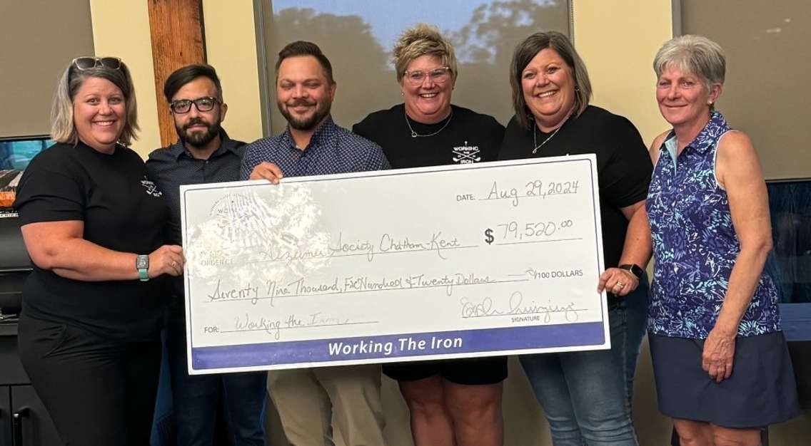 Working the Iron golf tournament cheque presentation (Image courtesy of Working the Iron Charity)