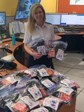 911 Dispatchers bought mittens, hats, socks, pocket warmers & 
TimHortons
 gift cards that will be handed out by local police officers to those in our community who are in need. (Photo courtesy of Chatham-Kent police)