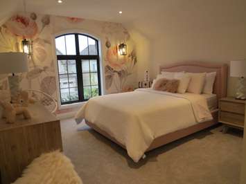 An upstairs bedroom inside the Dream Lottery home at 2397 Meadowlands Way. (Photo by Miranda Chant, Blackburn News)