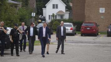 Maxime Bernier escorted by Sarnia police officers into an event at Sarnia Library Theatre. October 1, 2019. (BlackburnNews.com photo by Colin Gowdy)