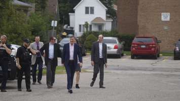 Maxime Bernier escorted by Sarnia police officers into an event at Sarnia Library Theatre. October 1, 2019. (BlackburnNews.com photo by Colin Gowdy)