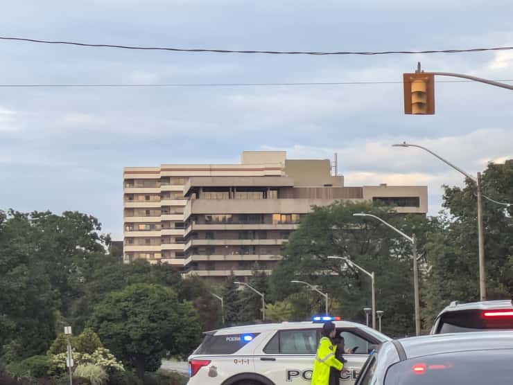Windsor police direct traffic at Riverside Drive East and Pillette Road, with a damaged traffic light visible, September 3, 2026. Photo by Mark Brown/WindsorNewsToday.ca.